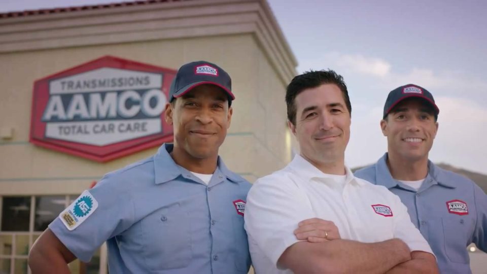 Aamco servicemen smiling